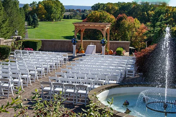 Outdoor wedding ceremony setup on the lawn at Hideaway Hills
